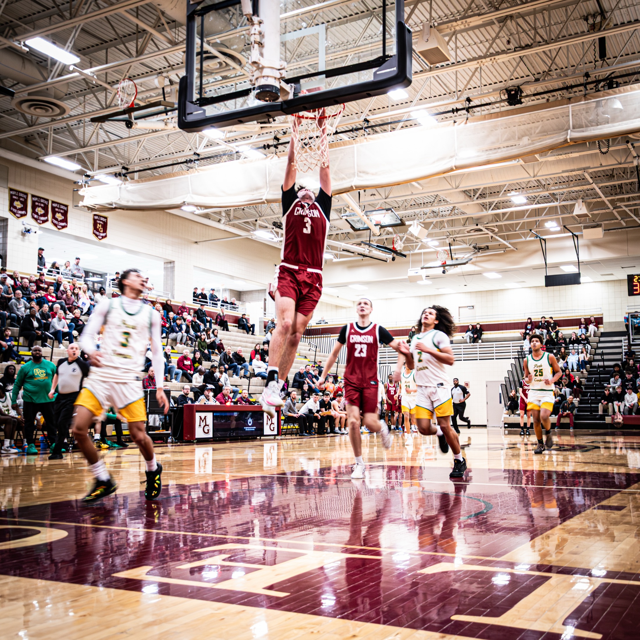 Basketball player dunking during a game