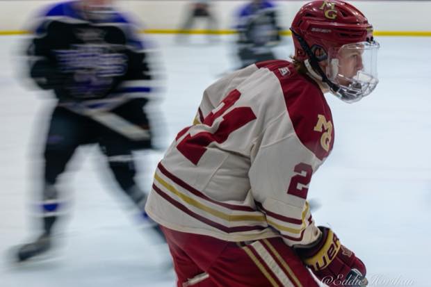 Hockey player skating during game coverage