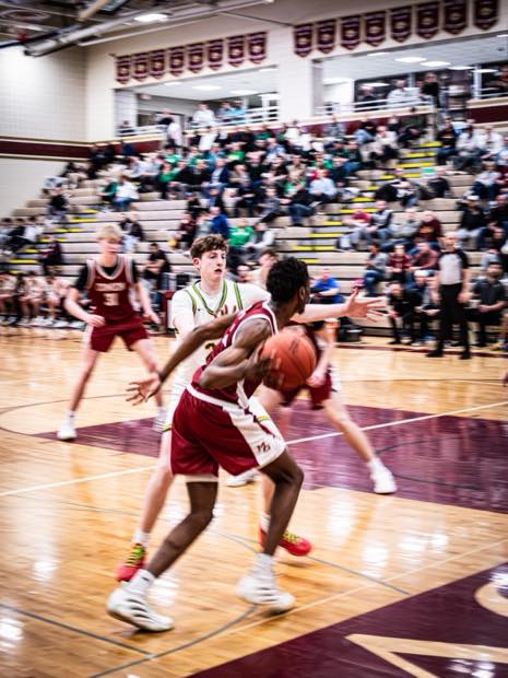Basketball action from half court