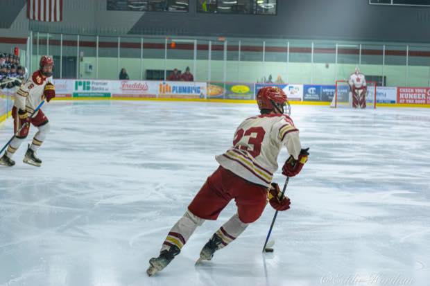 Hockey player skating into open ice